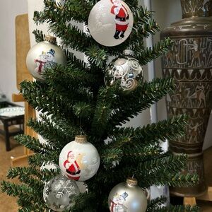 Festive Green Christmas Tree with Santa and Snowman Ornaments